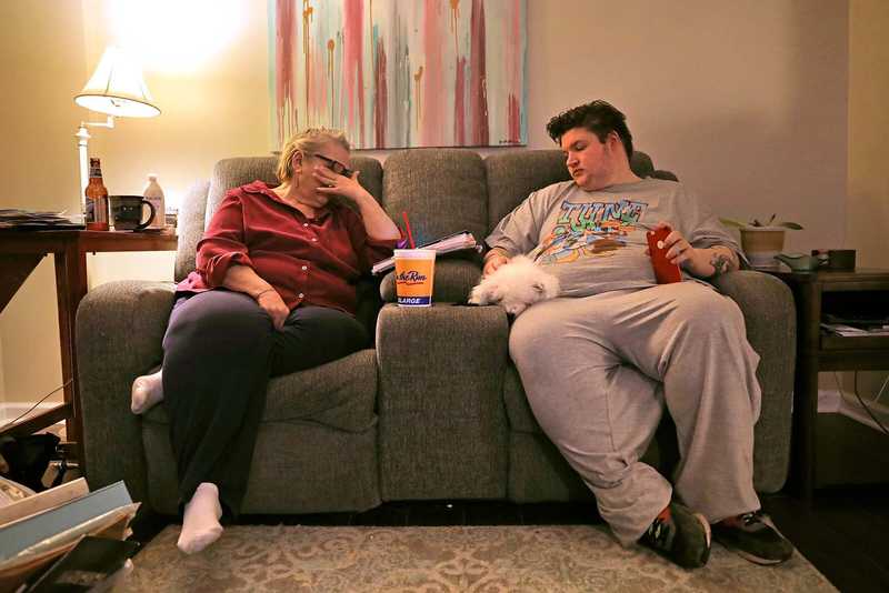 Lonni Schicker is holding an image of herself when she worked as a nurse's aide and a technician in the burn unit at what was then St. John's Mercy Medical Center.